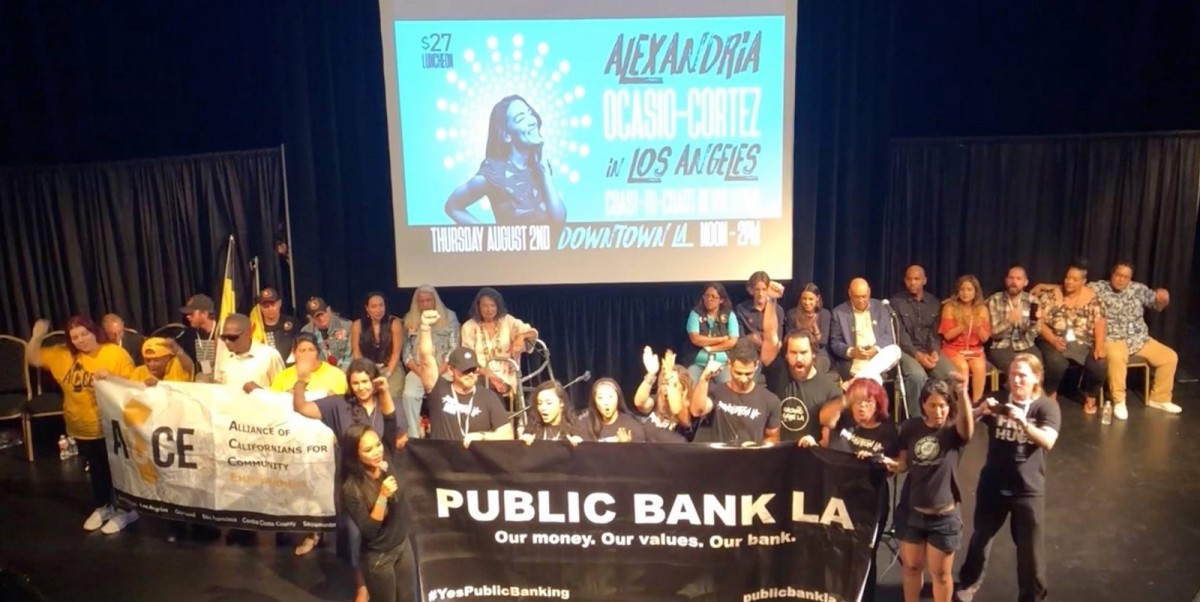 Public Bank LA on stage at an Alexandria Ocasio-Cortez event in downtown Los Angeles on August 2, 2018.