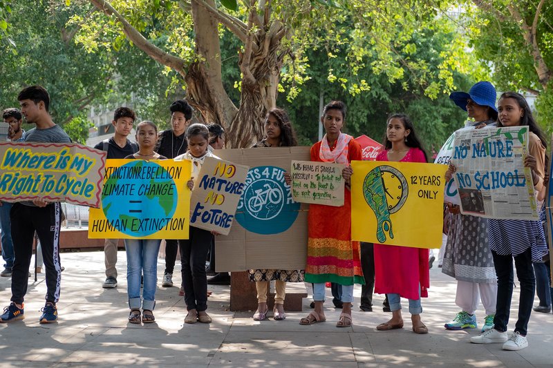 Indian students and school children hold placards as they participate in a global strike for urgent climate action in New Delhi on May 24, 2019. Laurene Becquart—AFP/Getty Images