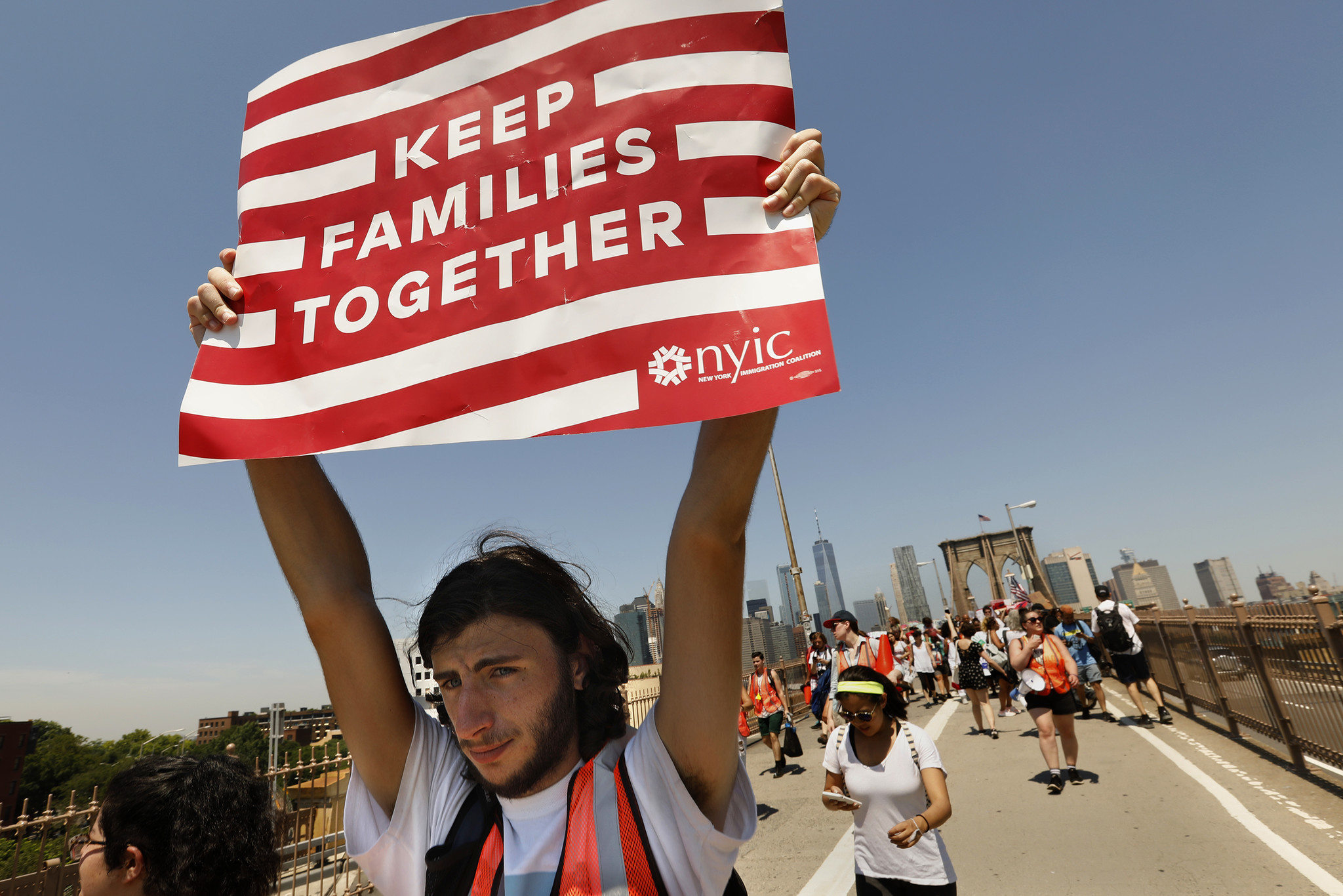 NEW YORK: Ariel Schwartz, 19, of Long Island, takes part in a march to keep families together. "I'm sick and tired of innocent families being treated like criminals," Schwartz said. Carolyn Cole / Los Angeles Times
