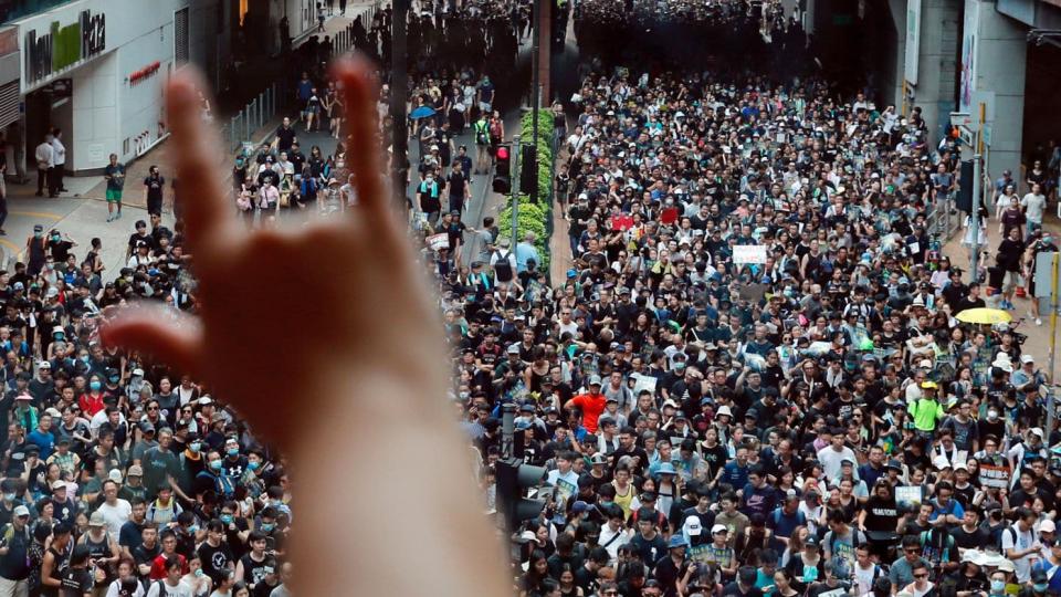 Demonstrators protesting an extradition bill march in the Sha Tin area of Hong Kong on Sunday. (Tyrone Siu/Reuters)